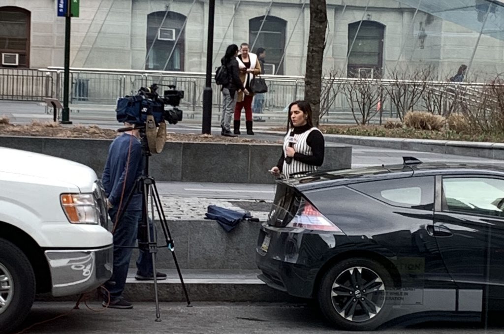 Reporter outside of Philadelphia City Hall at rush hour on Friday. 