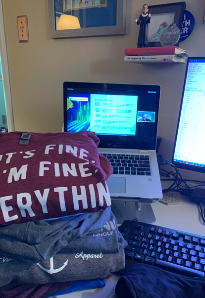 laptop and pile of laundry