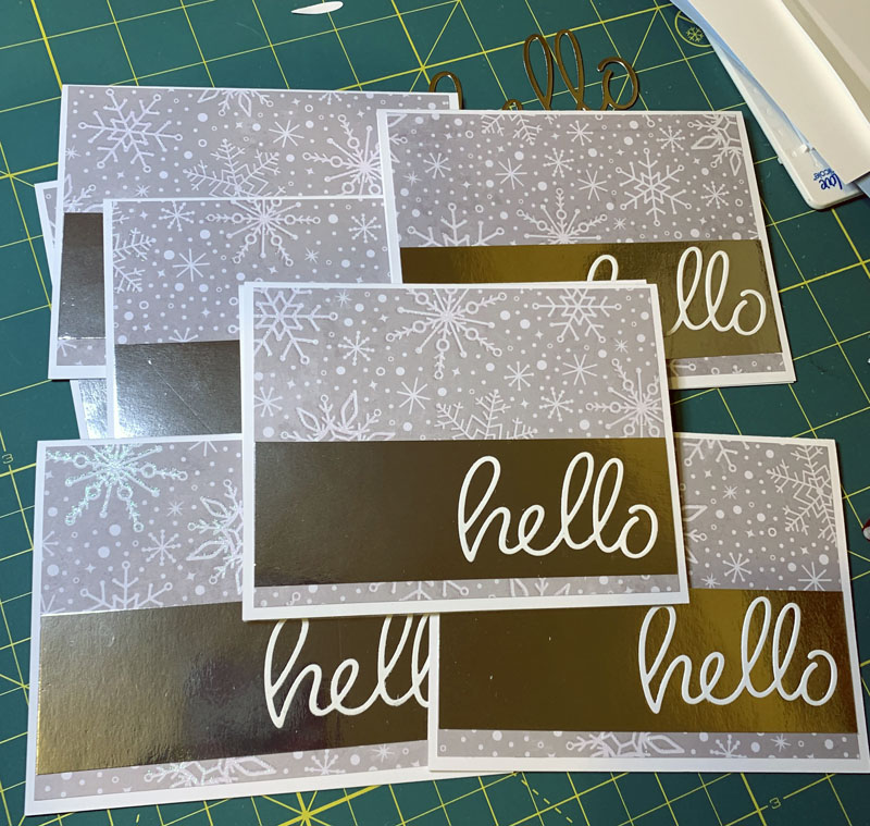 a pile of sparkly cards that say hello