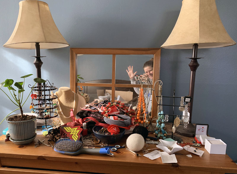 a giant pile of clutter and shit all over my dresser top. you can't even see the jewelry.