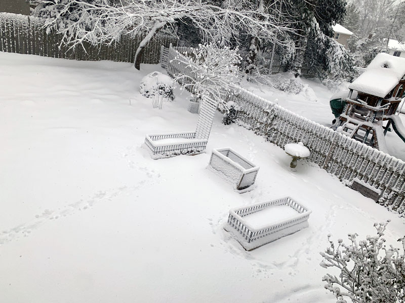 second story shot of the garden beds covered in snow