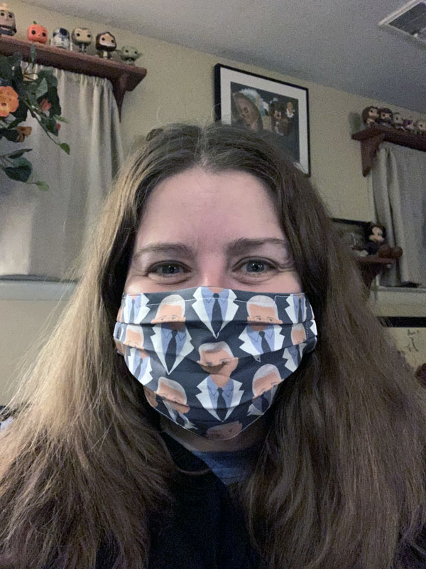 kim wearing a fabric face mask with dr fauci print