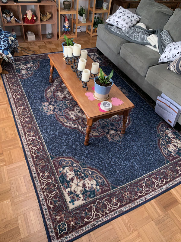 area carpet on a very dated parquet floor