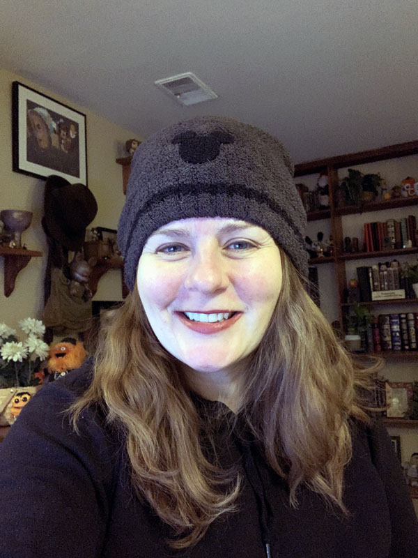 Selfie, wearing a mickey mouse beanie hat and some snazzy lipstick.