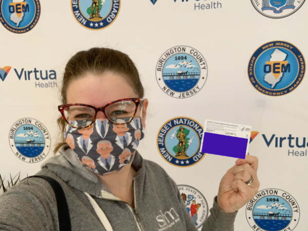 stupid Kim cheesing it up at the vaccine center selfie station.