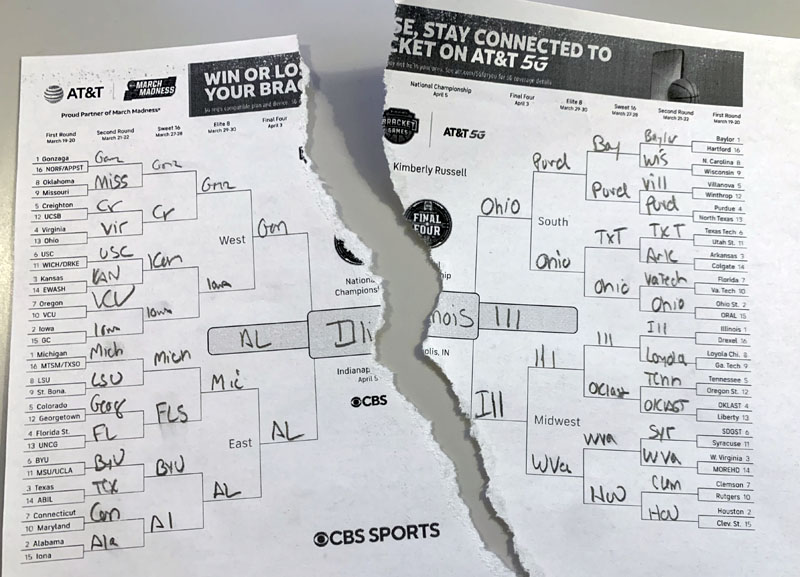 my printed out NCAA bracket, torn in half.