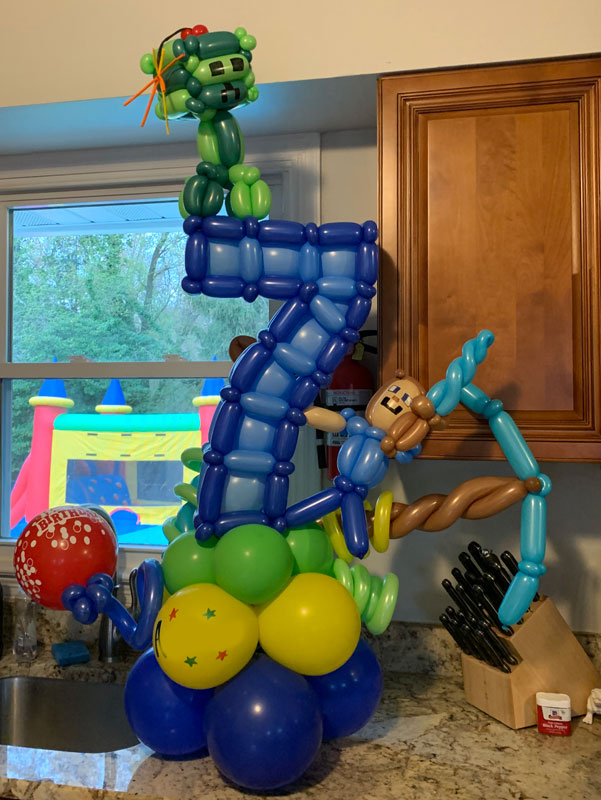 a Minecraft-themed balloon sculpture in the shape of the number 7