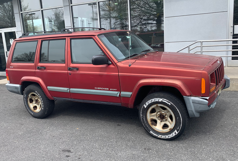 photo of a chili pepper red Jeep Cherokee