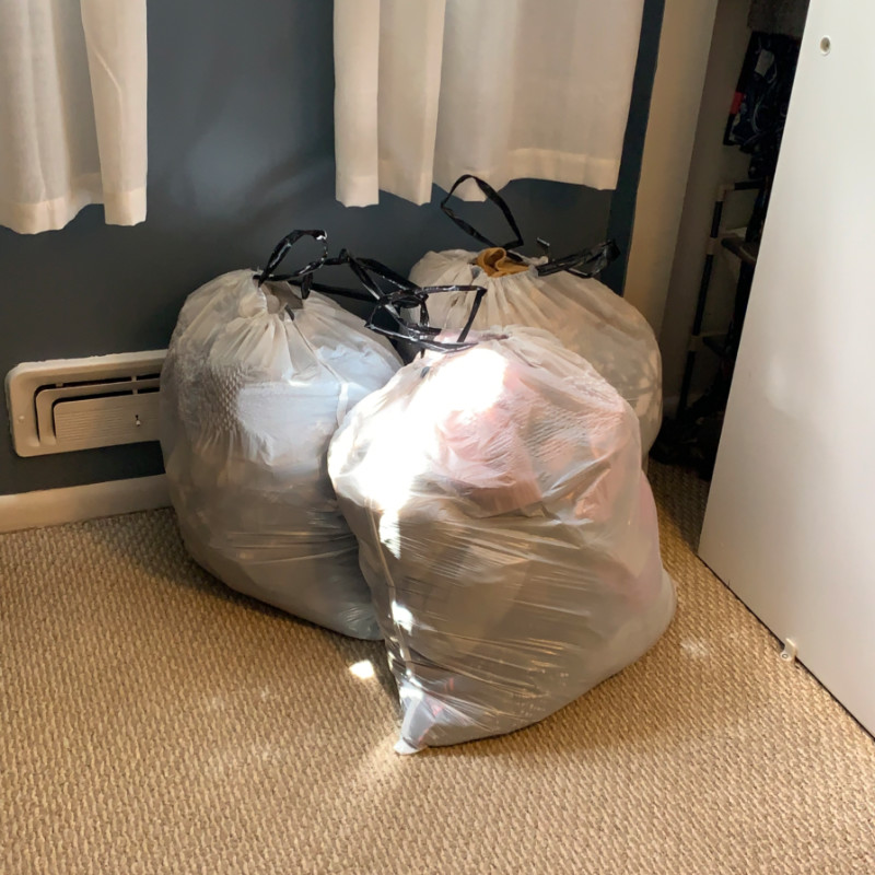 a photo of three garbage bags filled with clothing. A scintillating photo, sure to draw people to my blog by the tens.