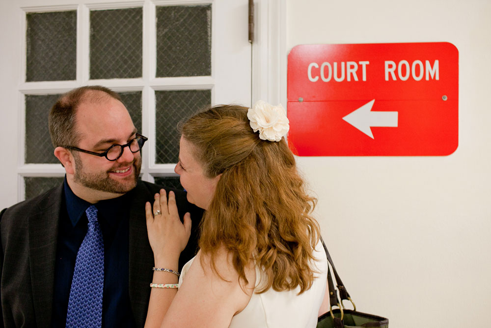 WM and I on our wedding day, nine years ago. Behind us is a sign that says Court Room