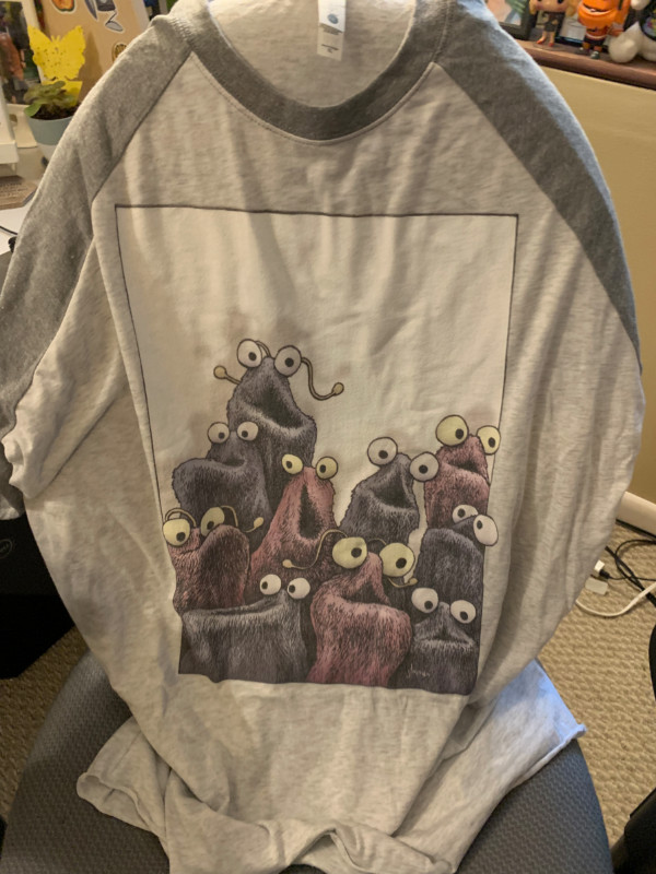 a teeshirt with the sesame street yip yip aliens on it.