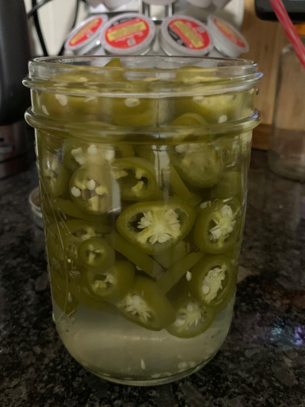 a jar of pickled jalapeno pepper slices