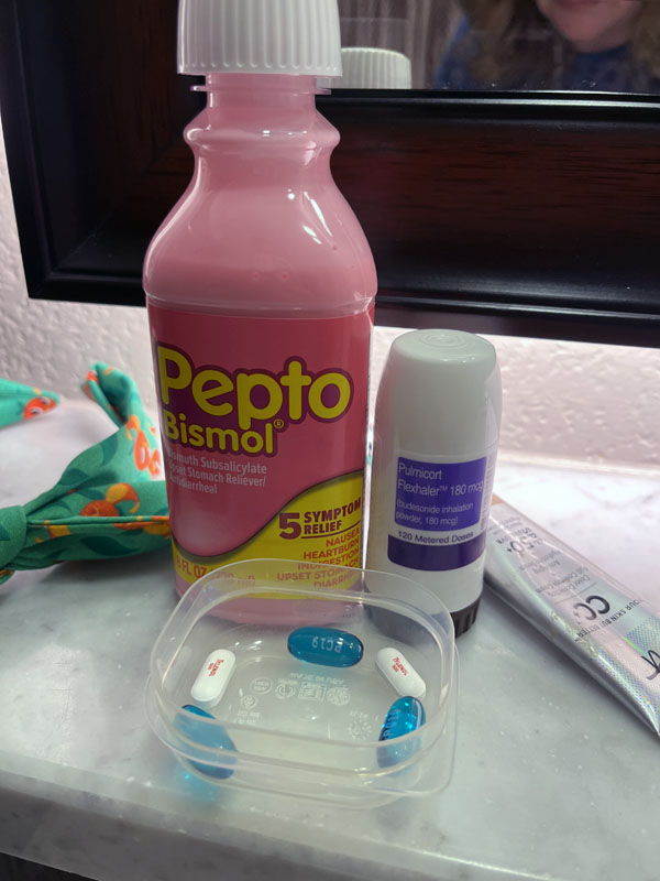 pepto, pain killer, and an inhaler