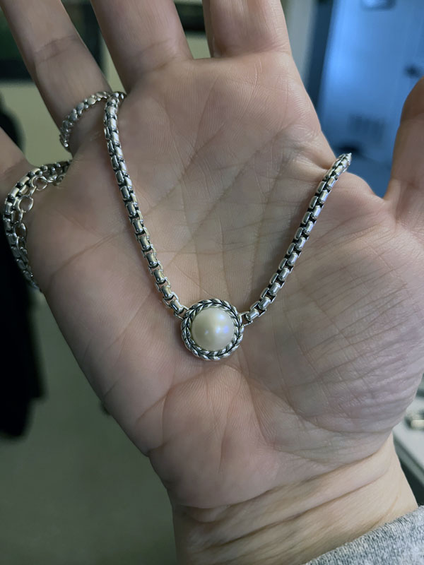 silver necklace with one large pearl