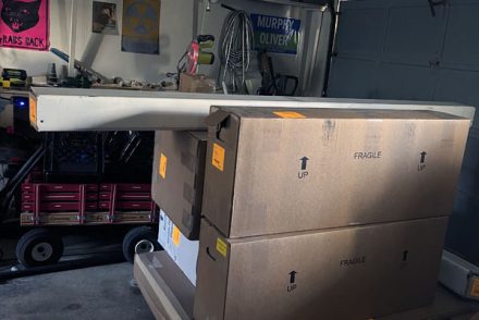 giant boxes on a pallet. not pictured: Kim's simmering doubt that this will fit in the proper room and her sinking feeling that her craft room will be completely overtaken.
