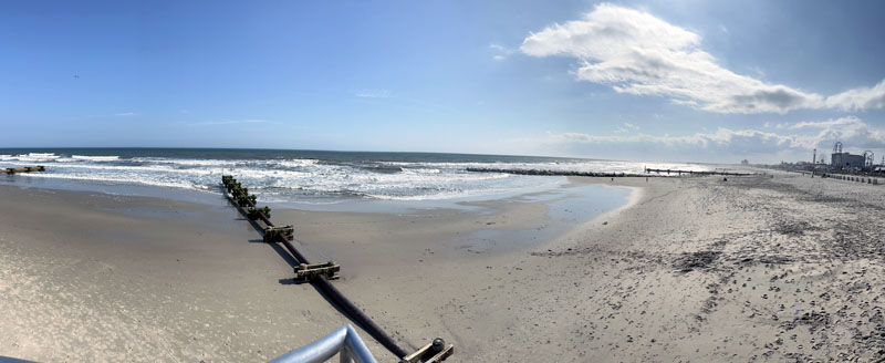 panoramic shot of the beach from the edge of ocean city, nj's music pier