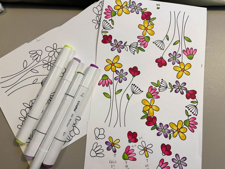 colored floral wreaths and alcohol markers