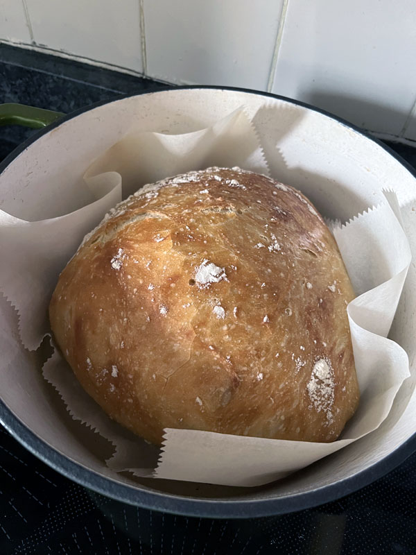 a warm round loaf of freshly-baked bread.