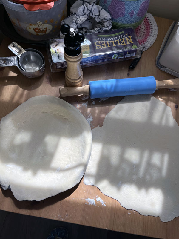 pie crust on a sun-dappled kitchen table