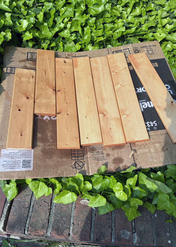 stained slats drying outside