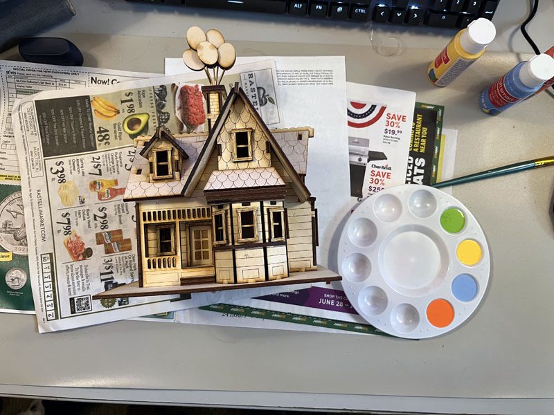 wooden house and paint palette