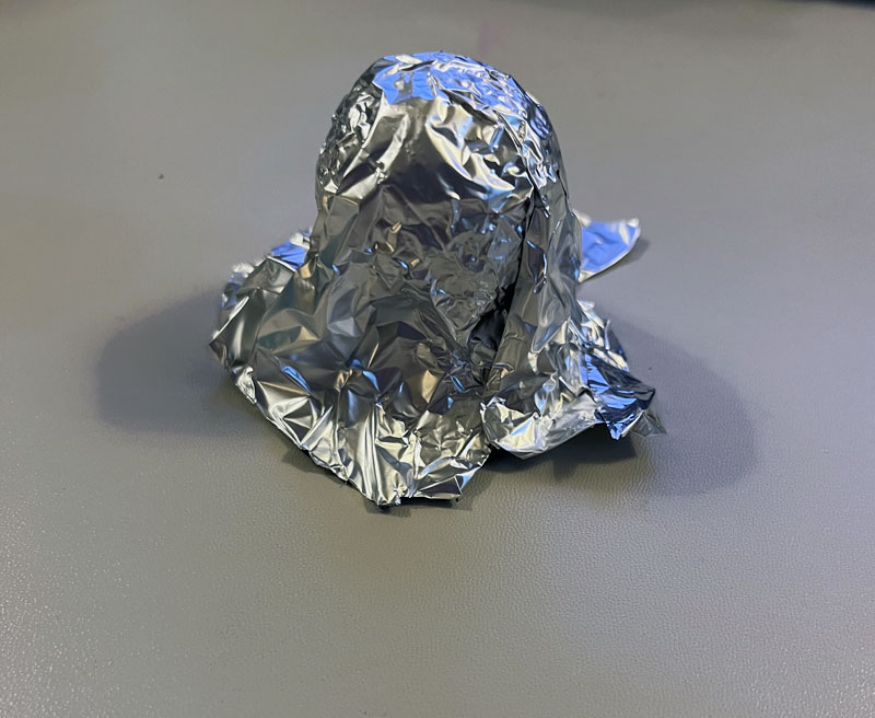 aluminum foil shaped into a ghost shape