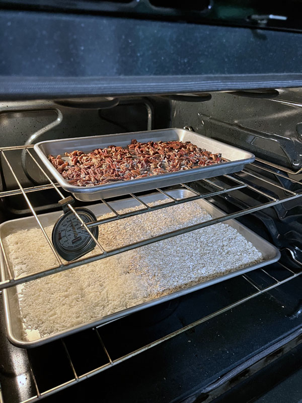 pecans, oats, and coconut toasting in my unclean oven