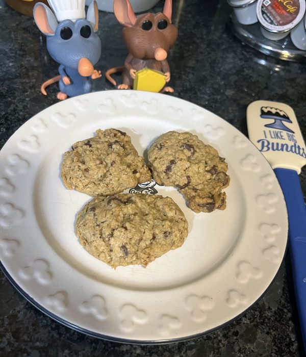 a plate of cowboy cookies with my Remy and Emile figurines looking on approvingly