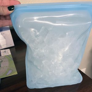 a blue half-gallon silicone bag filled with ice