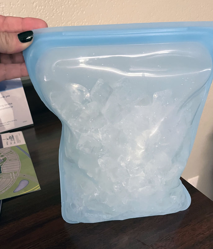 a blue half-gallon silicone bag filled with ice