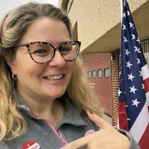 kim with her "i voted" sticker after going to the local election JUST to vote against the school board candidate thinks we shouldn't be teaching about race, gender, or climate in our schools.