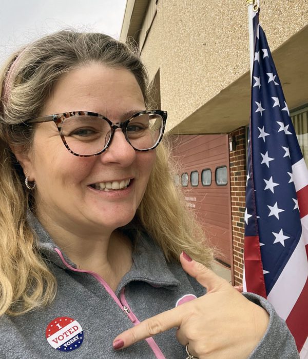 kim with her "i voted" sticker after going to the local election JUST to vote against the school board candidate thinks we shouldn't be teaching about race, gender, or climate in our schools.