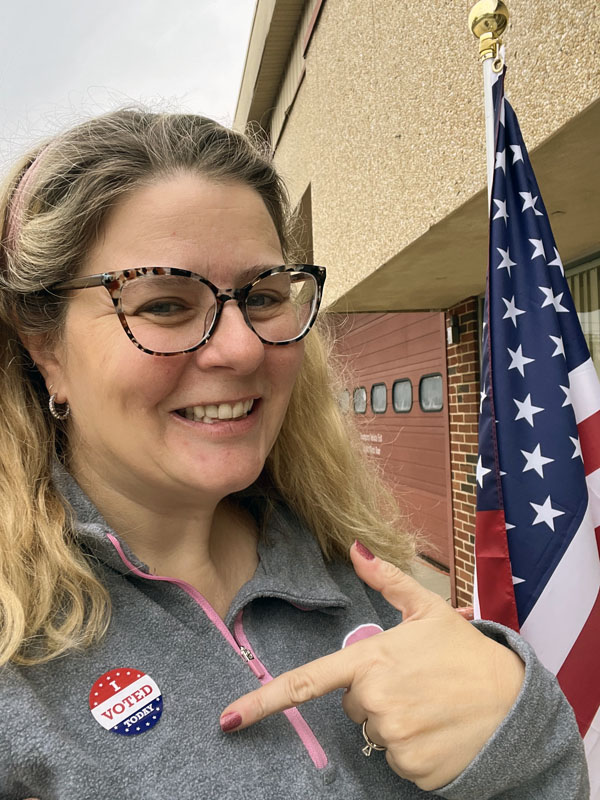 kim with her "i voted" sticker after going to the local election JUST to vote against the school board candidate thinks we shouldn't be teaching about race, gender, or climate in our schools.