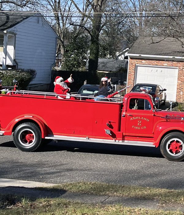 Santa on an old firetruck.