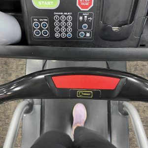 Kim's feet on a treadmill. AT THE GYM.