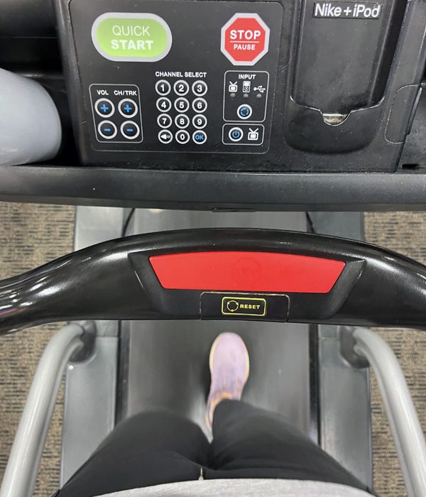 Kim's feet on a treadmill. AT THE GYM.