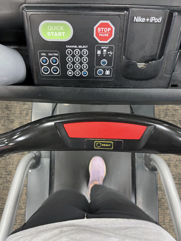Kim's feet on a treadmill. AT THE GYM.