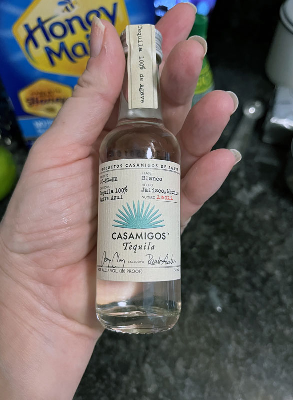 a tiny sample bottle of Casamigos tequila
