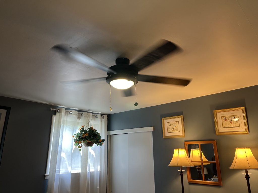 a functional ceiling fan in Kim's seldom-seen bedroom, which is blue.