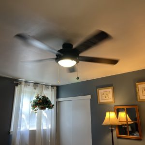 a functional ceiling fan in Kim's seldom-seen bedroom, which is blue.