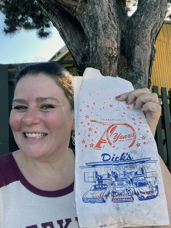 Kim holding a bag of Dick's.