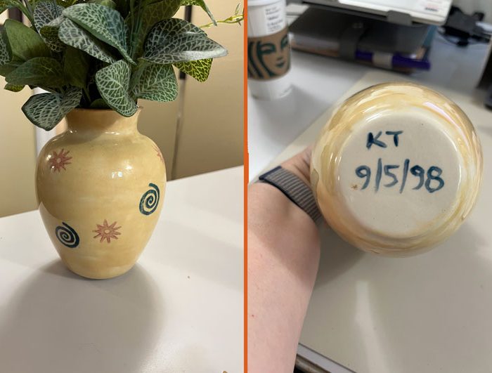 left: a yellowish ceramic vase with blue spirals and orange suns stamped onto it. R: the bottom of the vase, reading KT 9/5/98