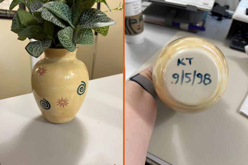 left: a yellowish ceramic vase with blue spirals and orange suns stamped onto it. R: the bottom of the vase, reading KT 9/5/98