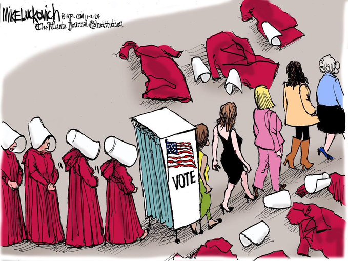 political cartoon by Mike Luckovich of the Atlanta Journal-Constitution. A line of women dressed like handmaids (red robes, white bonnets) approach an election booth. They leave in modern womens' clothing and the long their path lie the discarded robes and bonnets