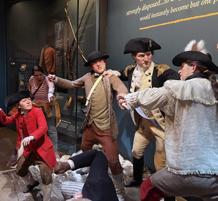 Museum of the American Revolution. A scene of American revolutionaries engaging in a fist (and iceball) fight against each other. Kim is in the background, jeering.