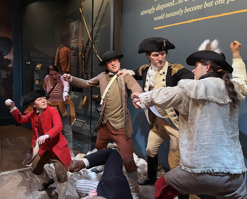 Museum of the American Revolution. A scene of American revolutionaries engaging in a fist (and iceball) fight against each other. Kim is in the background, jeering.