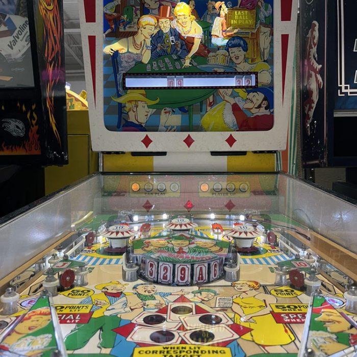 an old pinball machine - Gottleib's King of Diamonds. The theme can be described as a poker game in an old west saloon. There are a lot of mechanical components in place of the digital ones we see today, especially the bumpers, the score, and the wheels.