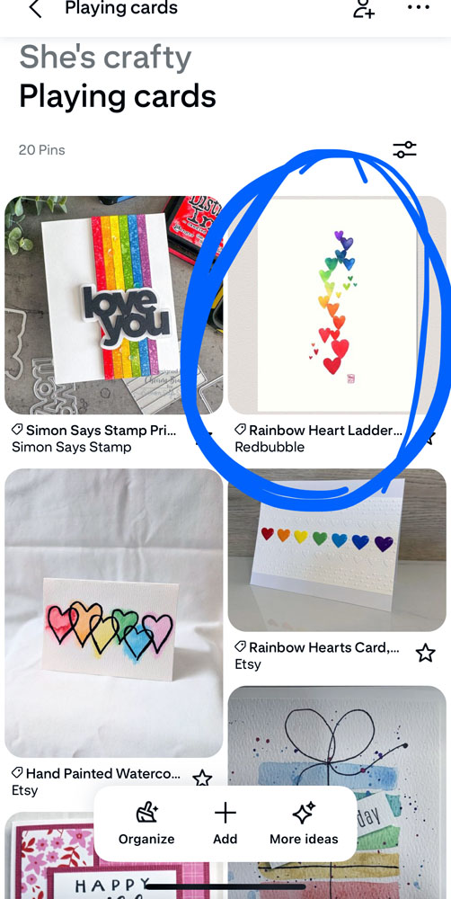 a screenshot from Pinterest featuring rainbow-themed cards. one of them is circled - it features a vertical stack of watercolored hearts. The bottommost ones are red, the topmost are purple, and as you move up the design, it's the colors of the rainbow.