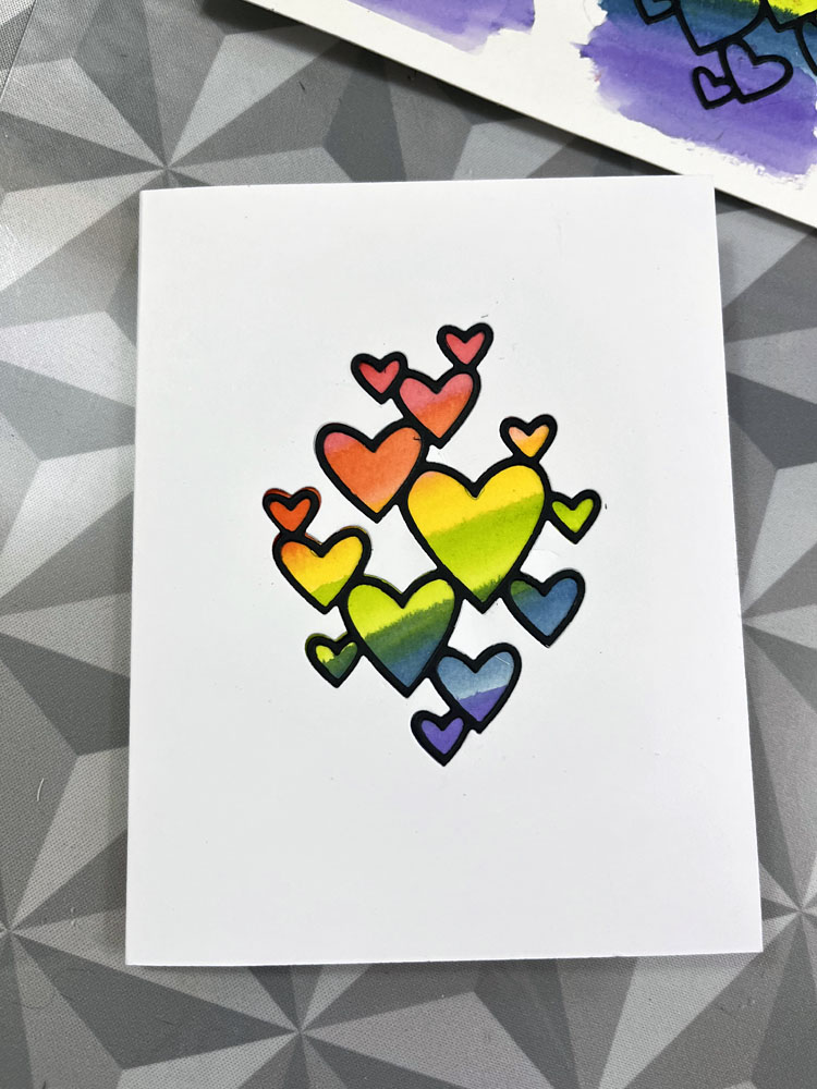 A finished card, white with rainbow hearts
