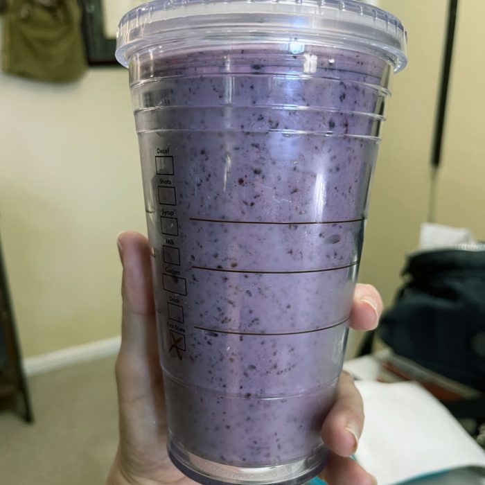 a blueberry banana smoothie in an insulated cup